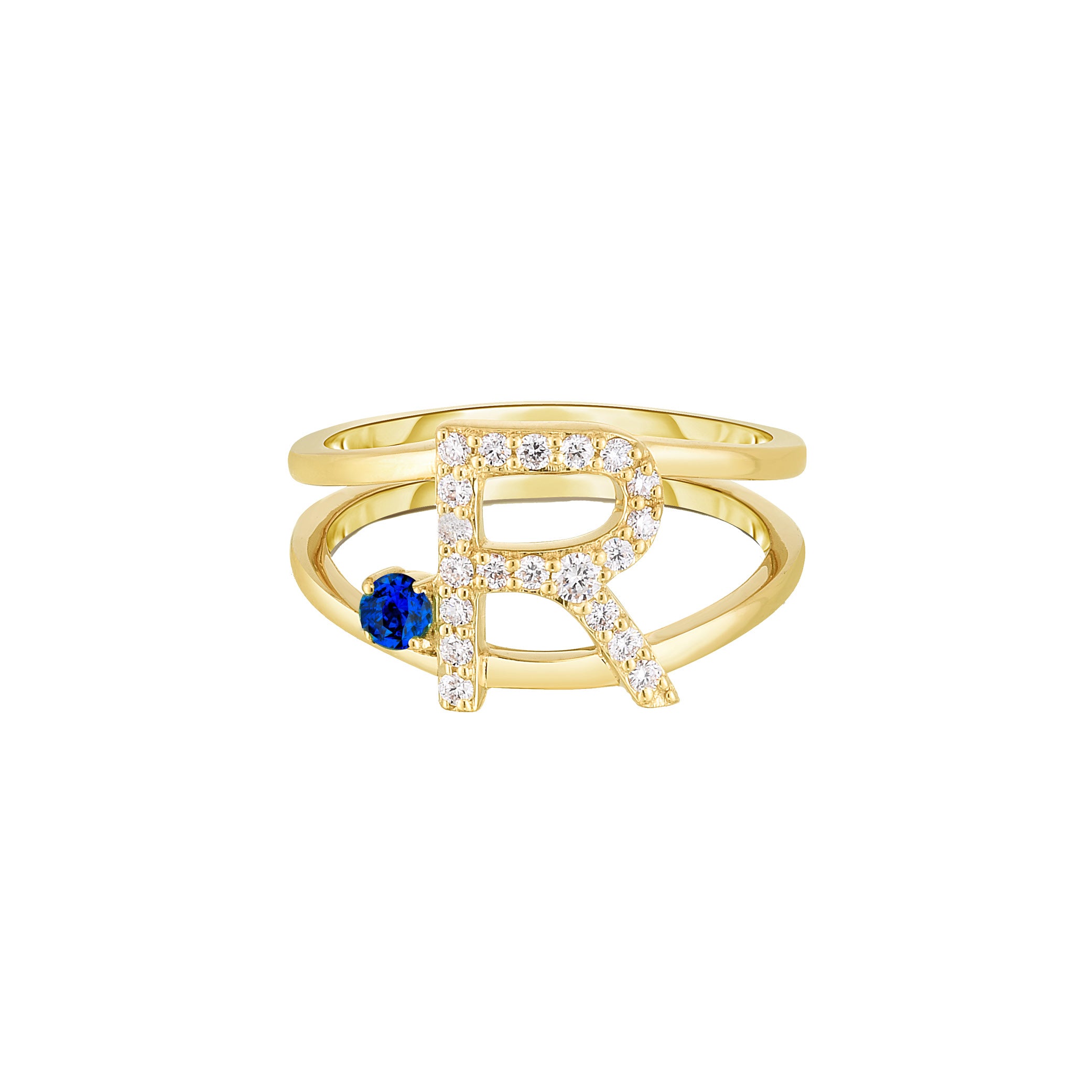 Gold ring with letter 'R' and blue gemstone