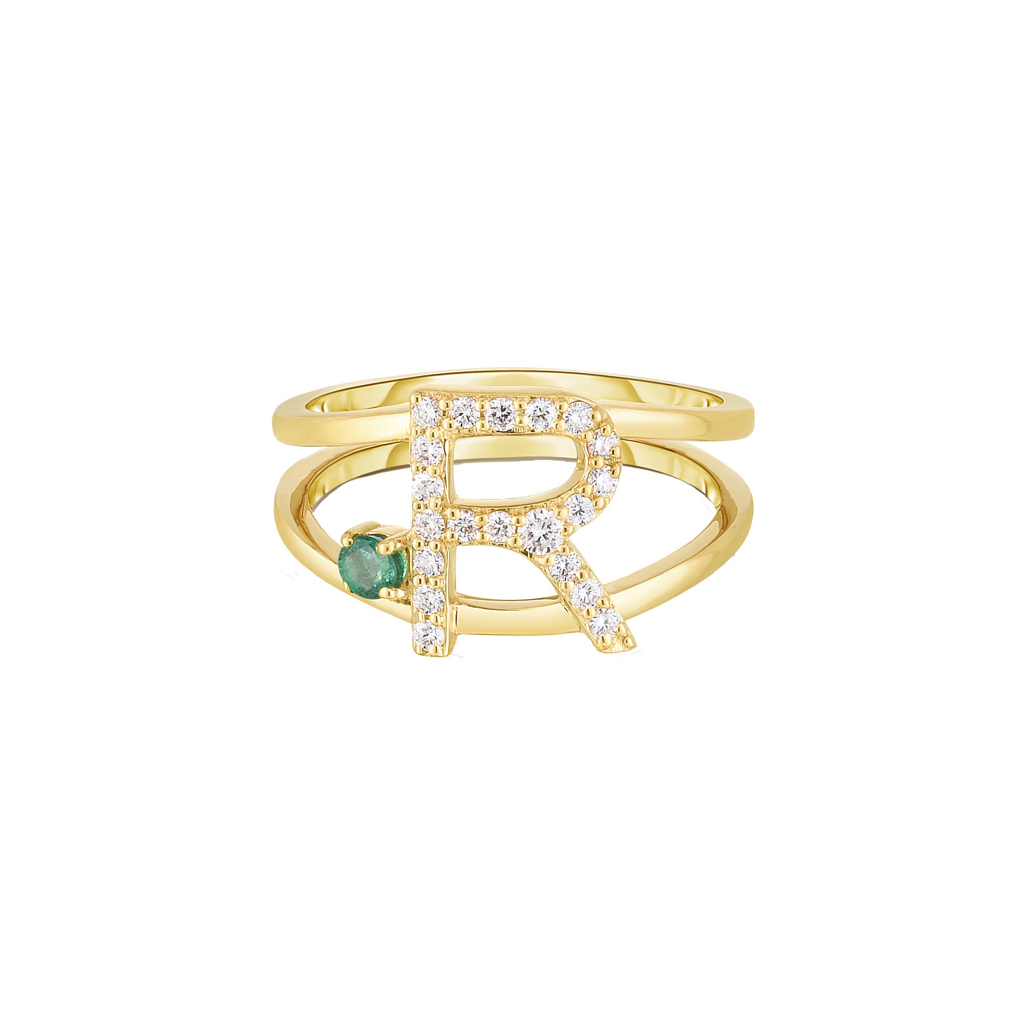 Gold ring with letter 'R' and green gemstone 